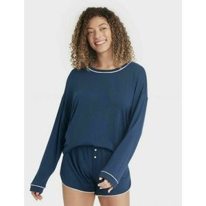 Navy blue stars above long sleeve pajama top